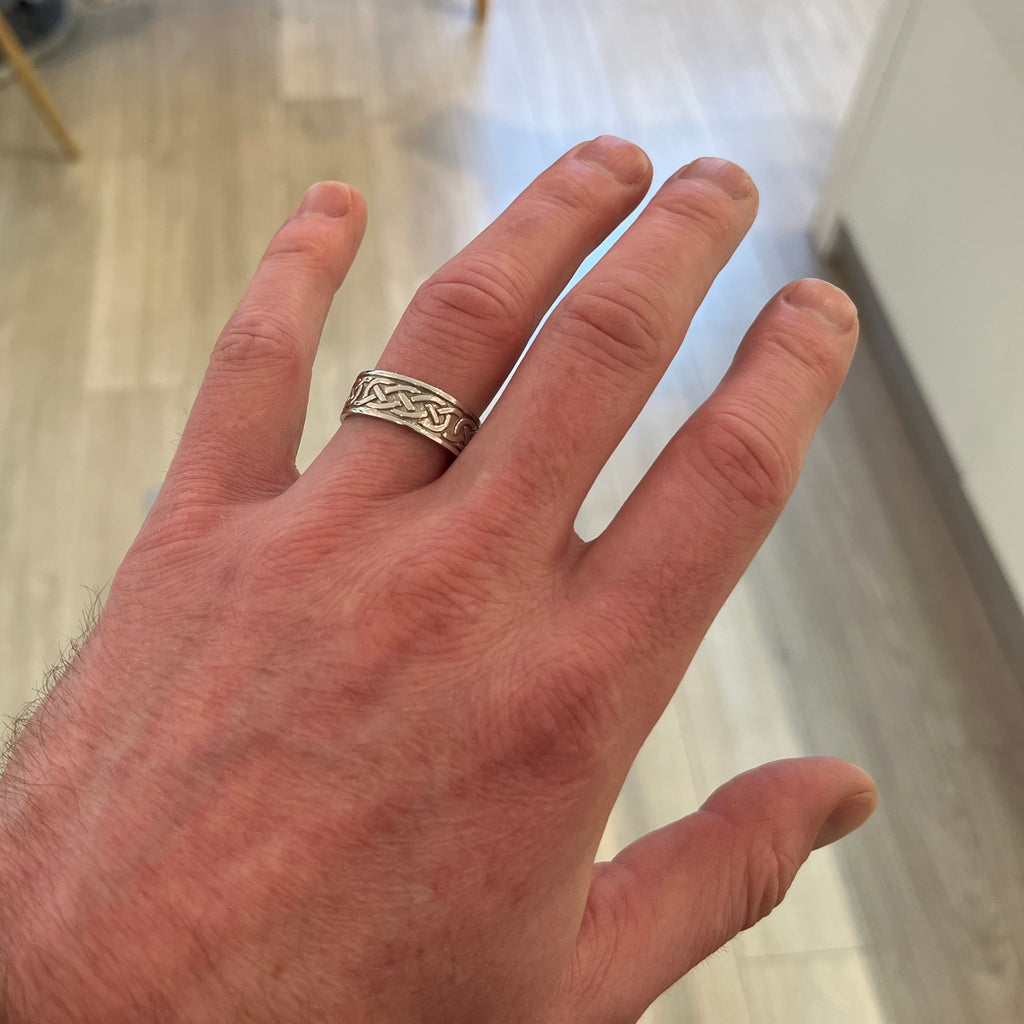 Photograph 2 of 14k White Gold Mens Celtic Knot Wedding Ring. Handmade in Ireland. Available on DESIGNYARD.com and in our Jewelry Store Dublin, Ireland. Free Worldwide Shipping with DHL.
