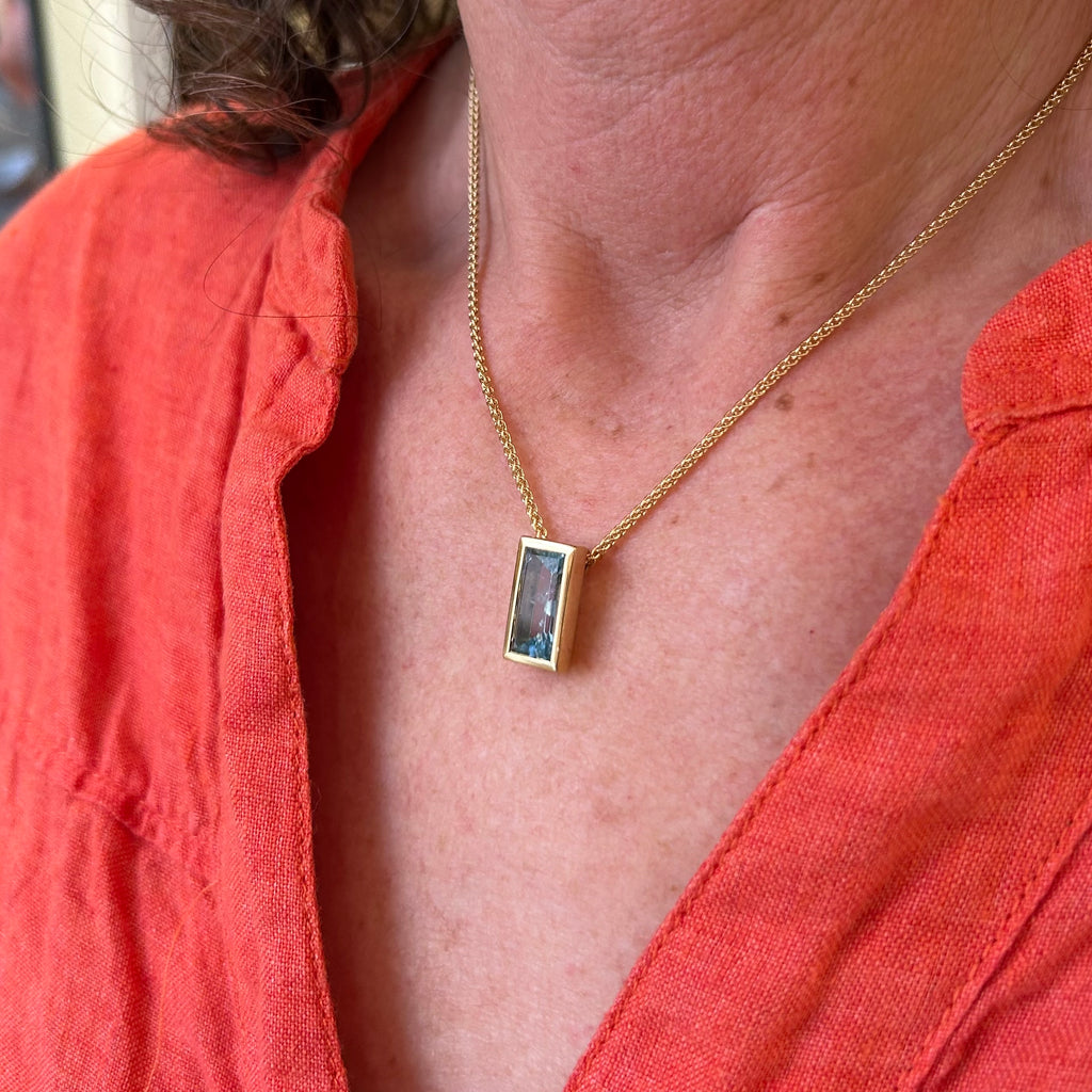 Photograph 2 of 18k Fair Trade Yellow Gold Tenues Bezəl Mirror Aquamarine Pendant. Available on DESIGNYARD.com and in our Jewellery Shop Dublin, Ireland. #1 for Contemporary Jewelery.