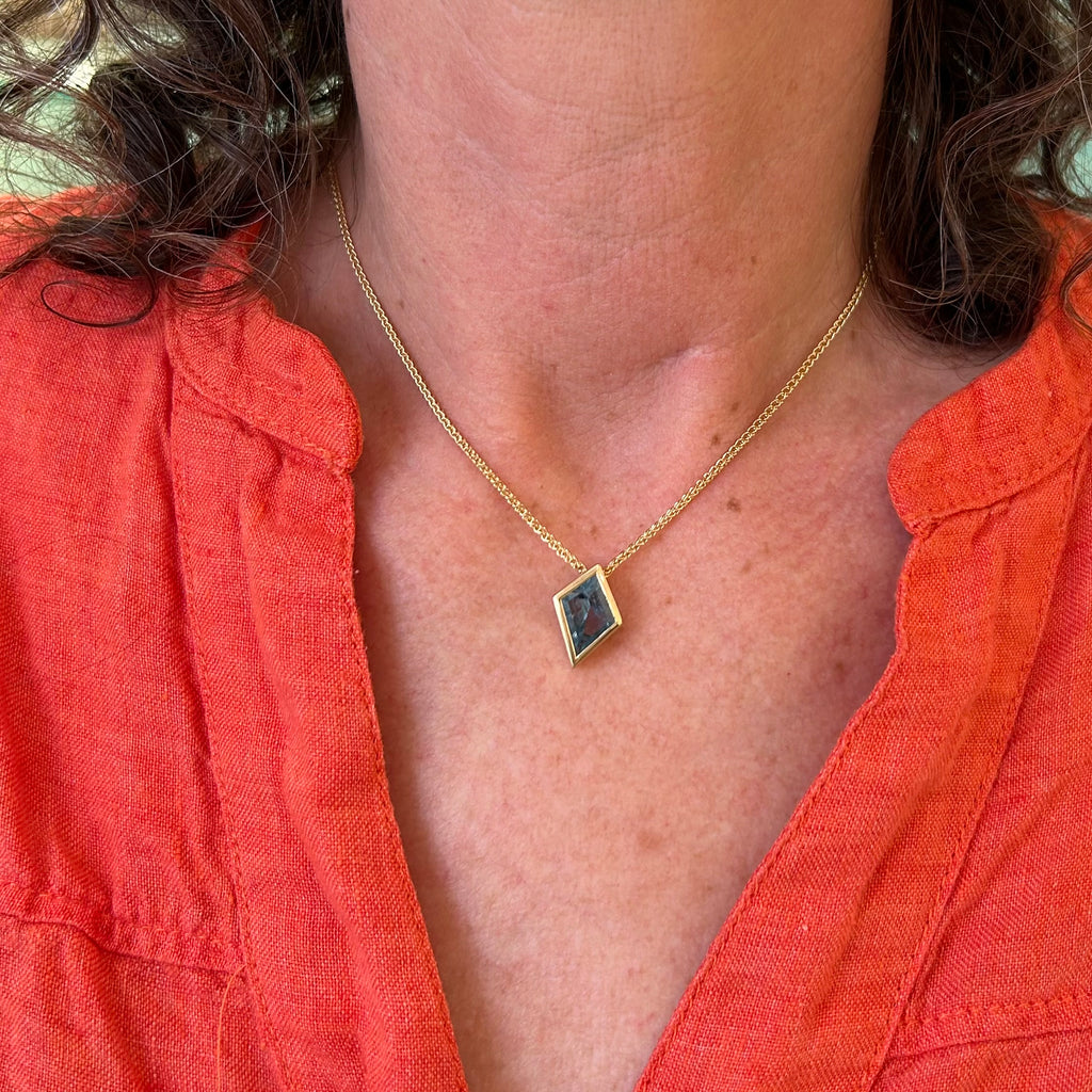 Photograph 2 of 18k Fair Trade Yellow Gold Tenues Bezəl Free Form Aquamarine Pendant. Available on DESIGNYARD.com and in our Jewellery Shop Dublin, Ireland. #1 for Contemporary Jewellery.