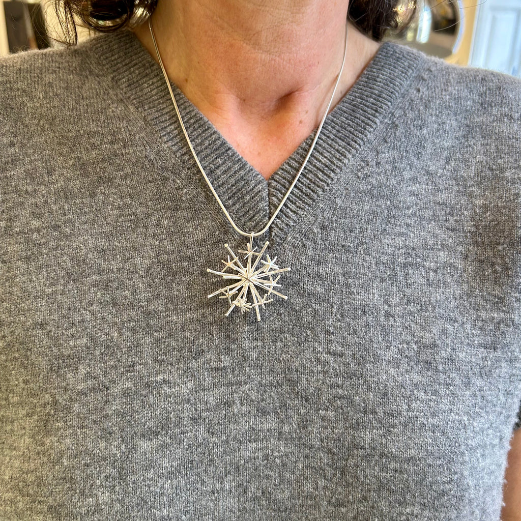 Photograph 4 of Martina Hamilton's Sterling Silver Chamaeleon Medium Pendant. Available on DESIGNYARD.com and in our Jewelry Store Dublin, Ireland.