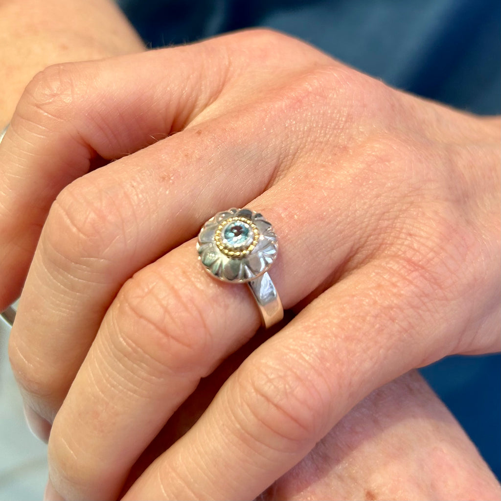Photograph 3 of Cassie Mc Cann's Contemporary 18k Yellow Gold Silver Blue Topaz Sunflower Ring. Available on DESIGNYARD.com and in our Jewellery Shop Dublin, Ireland. Free Worldwide Shipping with DHL.