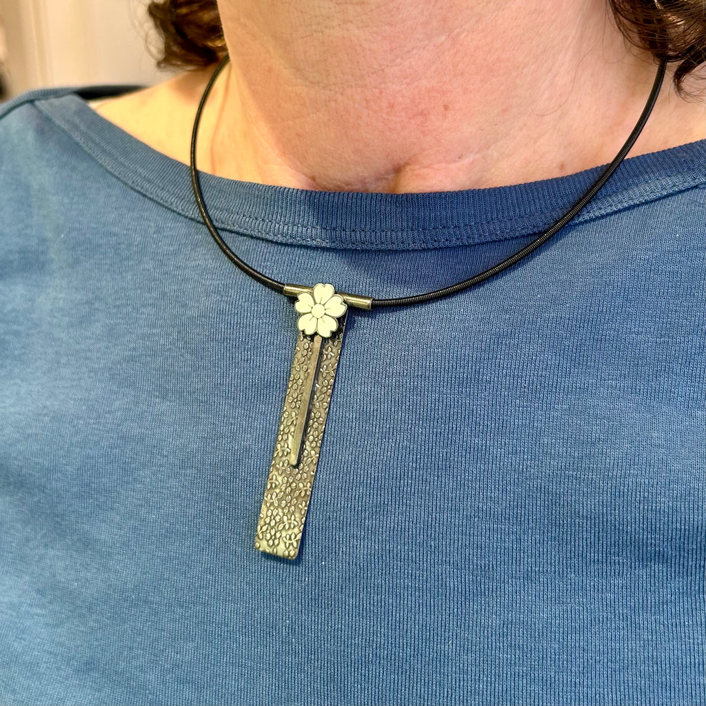 Photograph 3 of Jane Moore's Contemporary Oxidised Sterling Silver White Flower Enamel Statement Necklace. Available on DESIGNYARD.com and in our Jewellery Shop Dublin, Ireland. Free Worldwide Shipping with DHL.
