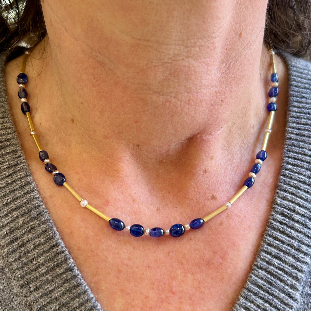 Photograph 3 of Catherine Mannheim's 18k Yellow Gold Sapphire Pearl Bar Necklace. Available on DESIGNYARD.com and in our Jewellery Shop Dublin, Ireland. Free Worldwide Shipping with DHL.
