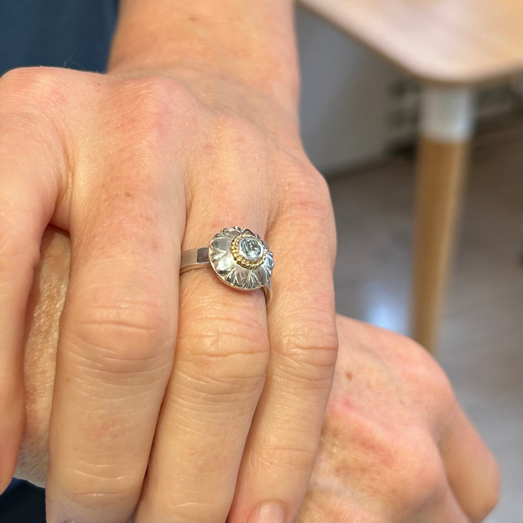 Photograph 4 of Cassie Mc Cann's Contemporary 18k Yellow Gold Silver Blue Topaz Sunflower Ring. Available on DESIGNYARD.com and in our Jewellery Shop Dublin, Ireland. Free Worldwide Shipping with DHL.