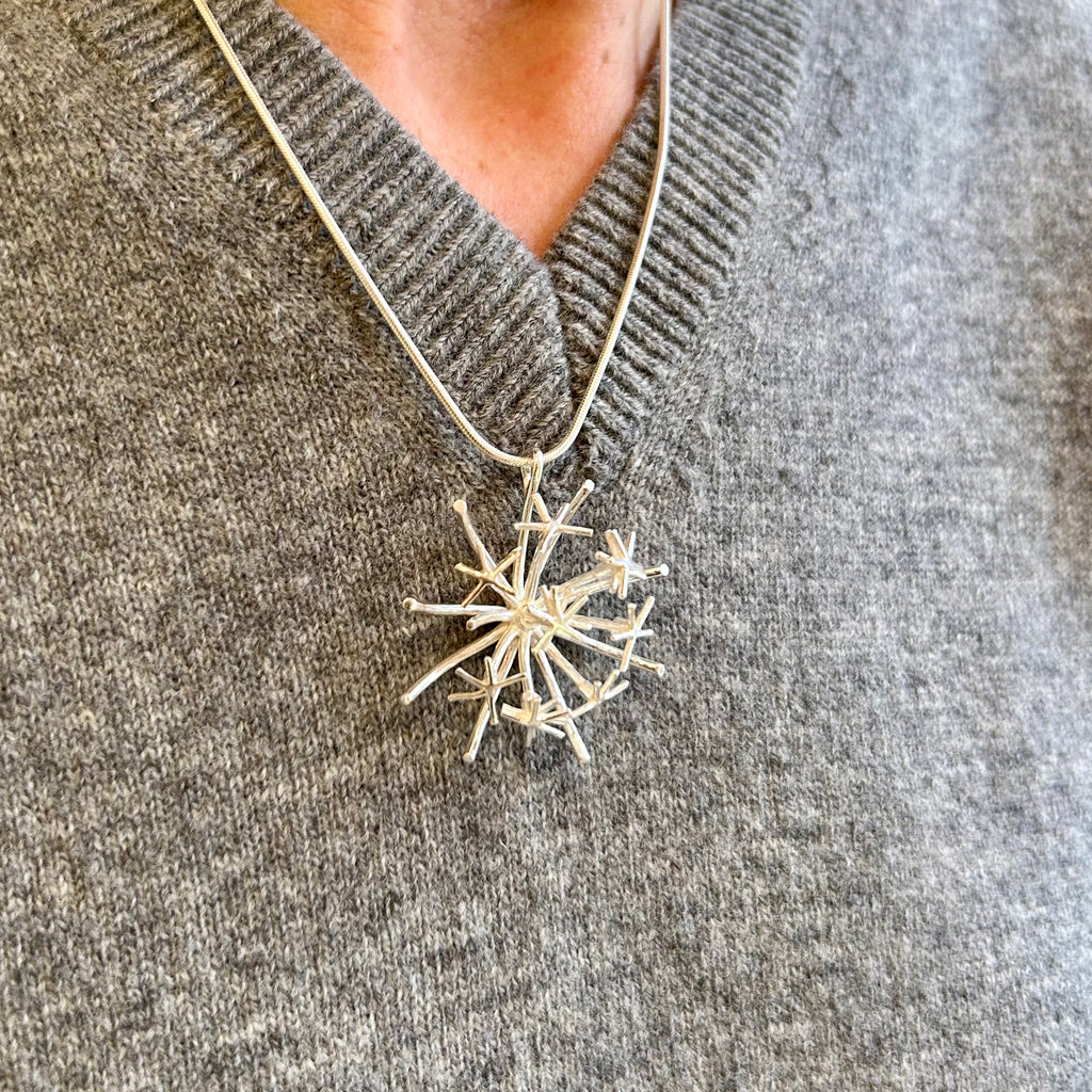 Photograph 2 of Martina Hamilton's Sterling Silver Chamaeleon Medium Pendant. Available on DESIGNYARD.com and in our Jewelry Store Dublin, Ireland.