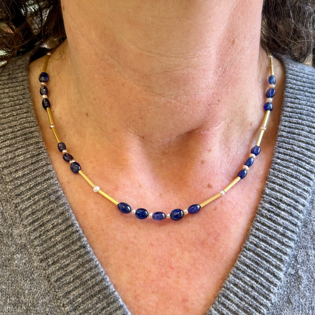 Photograph 4 of Catherine Mannheim's 18k Yellow Gold Sapphire Pearl Bar Necklace. Available on DESIGNYARD.com and in our Jewellery Shop Dublin, Ireland. Free Worldwide Shipping with DHL.