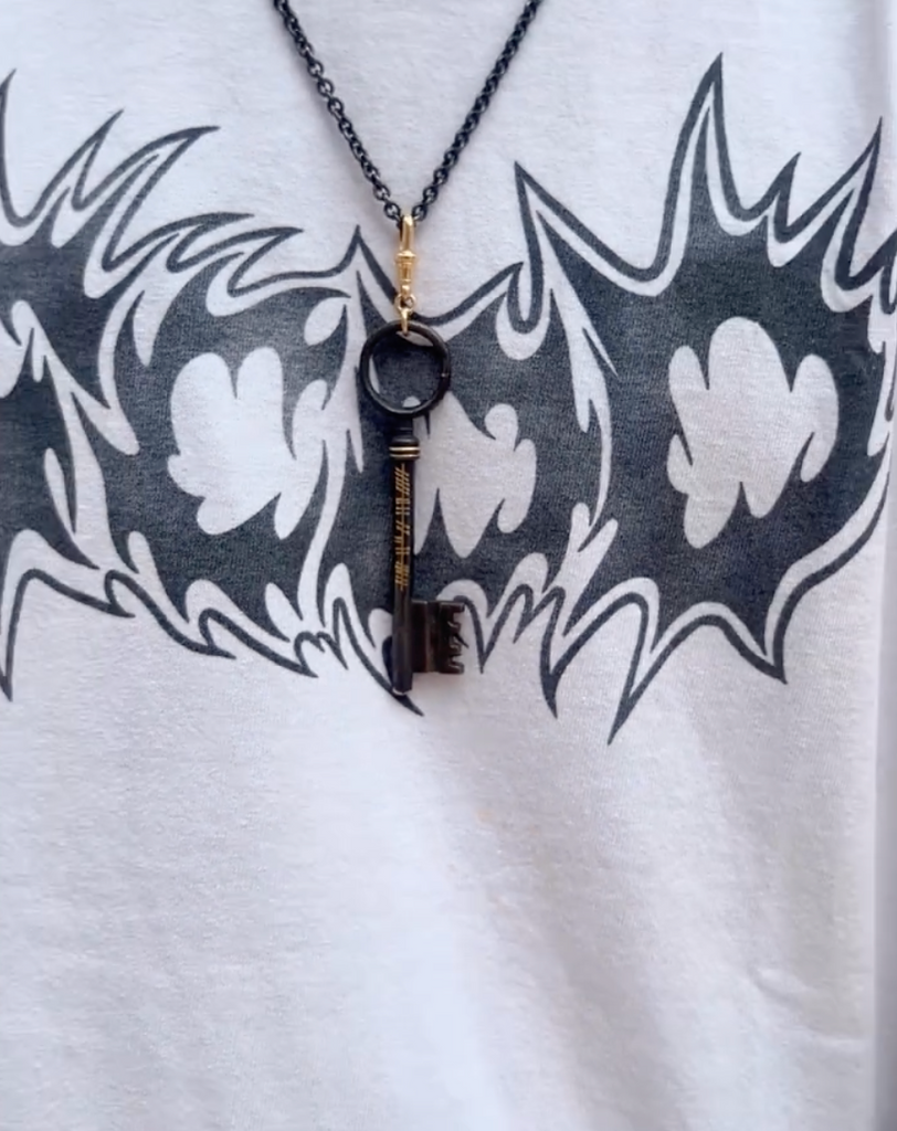 Photograph 2 of Sam Lafford's 18k Yellow Gold Oxi Rodger Ogham Key Pendant. Available on DESIGNYARD.com and in our Contemporary Jewellery Shop Dublin, Ireland. Free Worldwide Shipping with DHL.