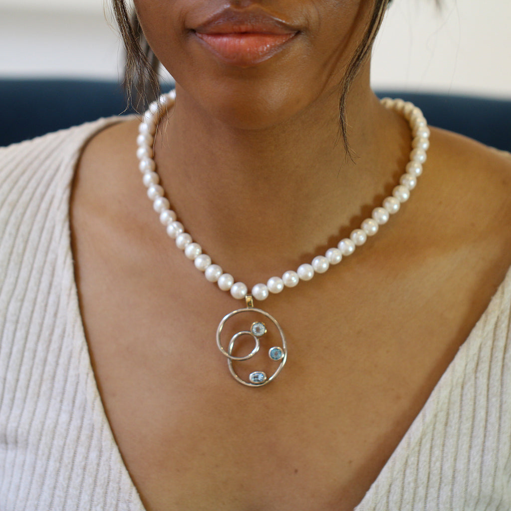 Photograph 2 of Friederike Grace's Contemporary Sterling Silver 18k Yellow Gold Blue Topaz Pearl Necklace. Available on DESIGNYARD.com and in our Jewelry Store Dublin, Ireland.