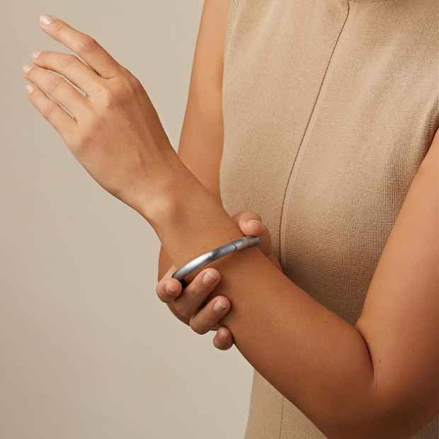 Photograph 4 of Henrich & Denzel's Janus Platinum Diamond Bangle. Available on DESIGNYARD.com and in our Contemporary Jewellery Shop Dublin, Ireland. Shipping Worldwide.