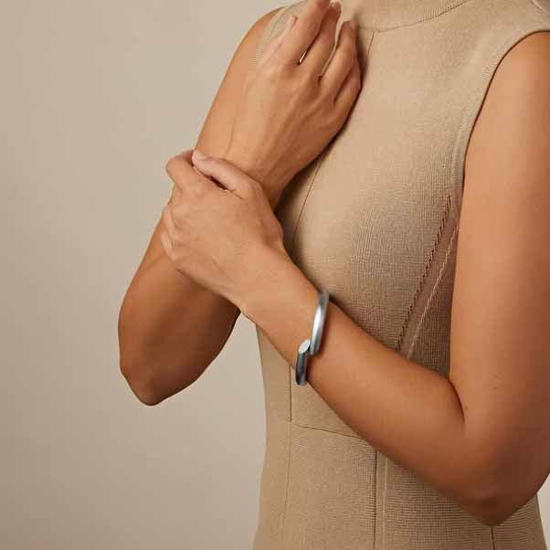 Photograph 2 of Henrich & Denzel's Janus Platinum Diamond Bangle. Available on DESIGNYARD.com and in our Contemporary Jewellery Shop Dublin, Ireland. Shipping Worldwide.