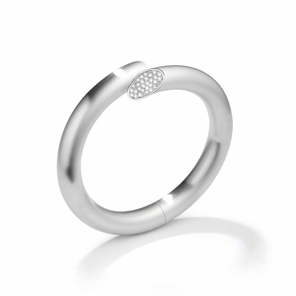 Photograph 1 of Henrich & Denzel's Janus Platinum Diamond Bangle. Available on DESIGNYARD.com and in our Contemporary Jewellery Shop Dublin, Ireland. Shipping Worldwide.