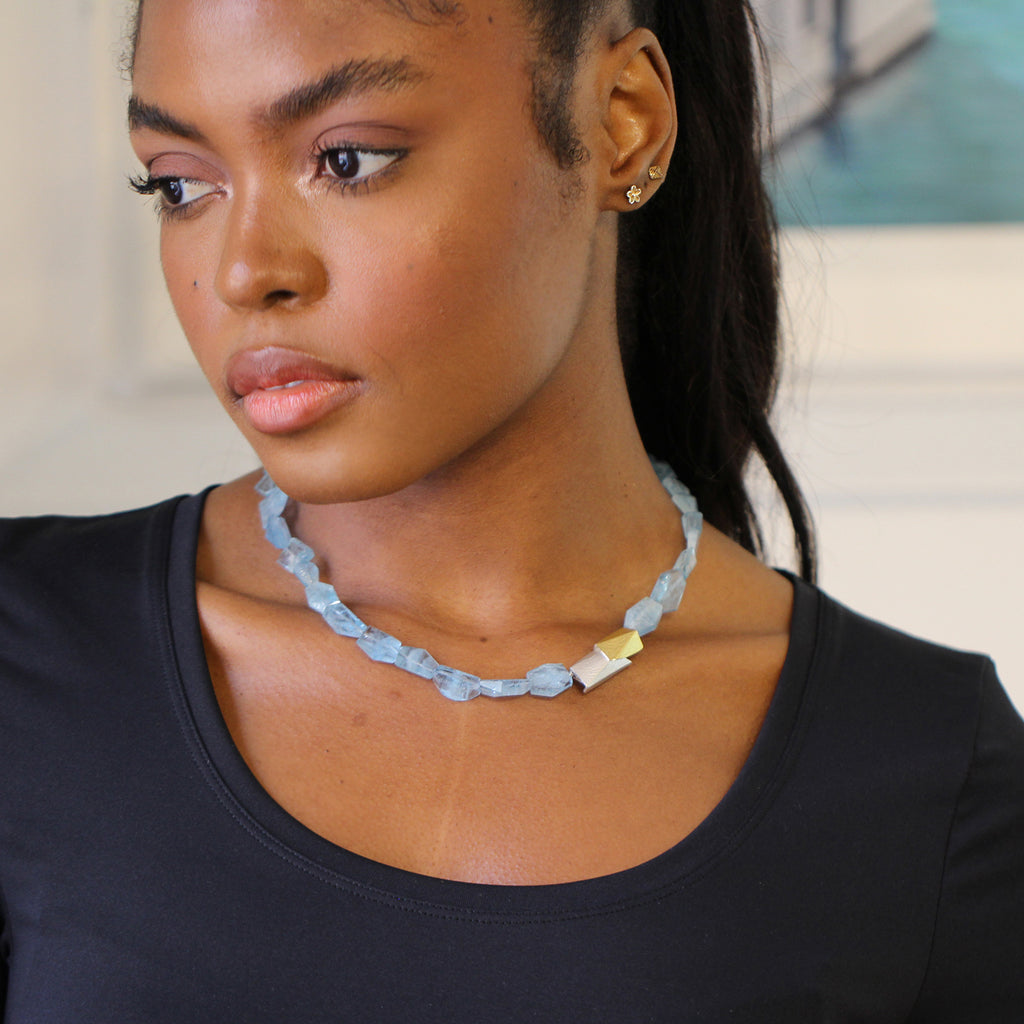 Photograph 1 of Manu's Sterling Silver 22k Yellow Gold Aquamarine Necklace. Available on DESIGNYARD.com and in our Contemporary Jewellery Shop Dublin, Ireland. Free Worldwide Shipping.