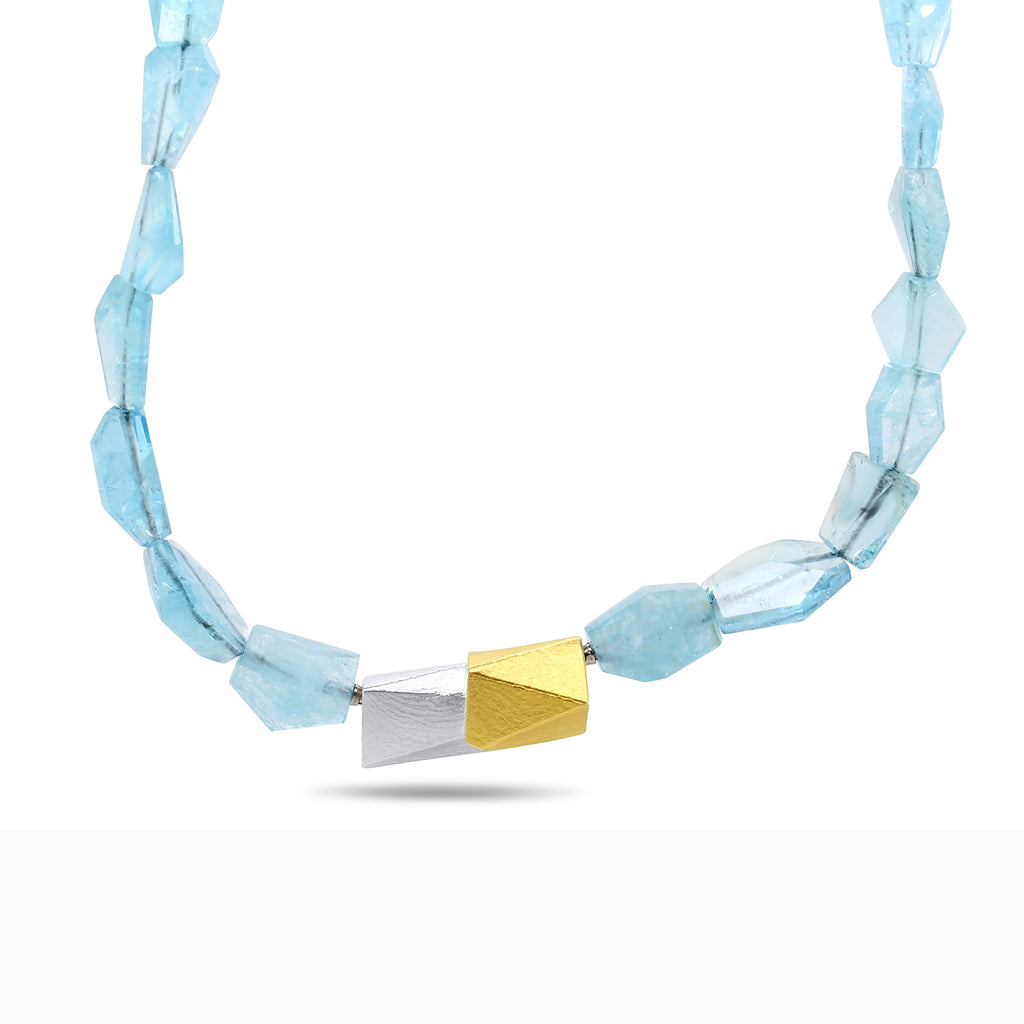 Photograph 2 of Manu's Sterling Silver 22k Yellow Gold Aquamarine Necklace. Available on DESIGNYARD.com and in our Contemporary Jewellery Shop Dublin, Ireland. Free Worldwide Shipping.