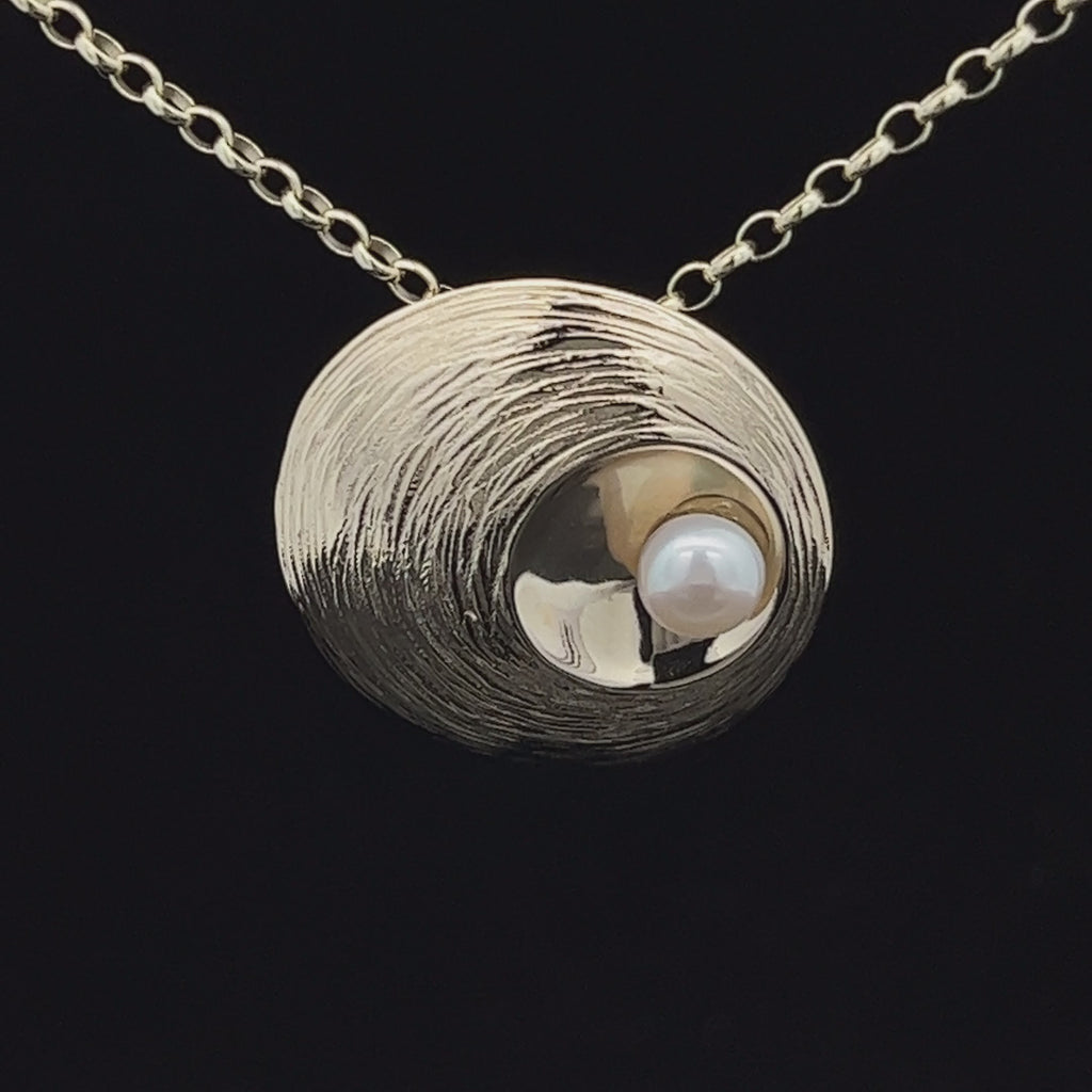 Video of Martina Hamilton's Contemporary Yellow Gold Oyster Pearl Pendant. Available on DESIGNYARD.com and in our Jewelry Shop Dublin, Ireland. Free Worldwide Shipping with DHL.