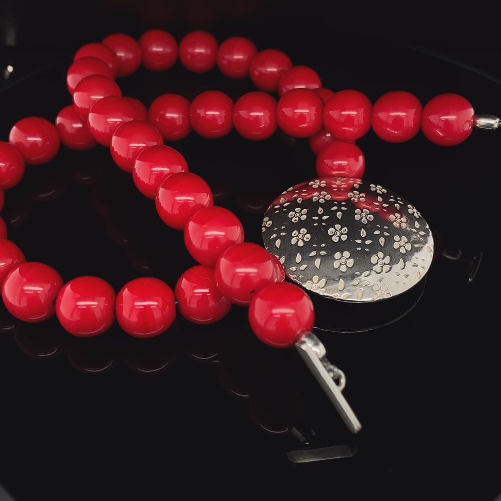 Jane Moore - Sterling Silver Red Glass Embossed Flower Necklace - DESIGNYARD, Dublin Ireland.