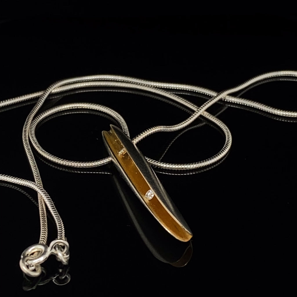 Video of Paul Finch's Contemporary Silver 22k Yellow Gold Diamond Large Shell Necklace.  Available on DESIGNYARD.com and in our Jewellery Shop Dublin, Ireland.