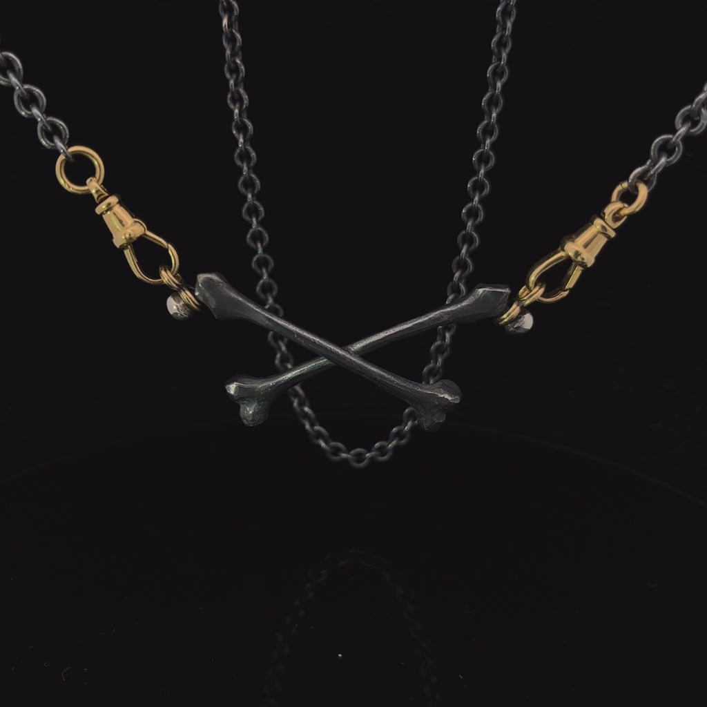sam lafford 18k yellow gold oxidised silver crossbones necklace designyard contemporary jewellery gallery dublin ireland 