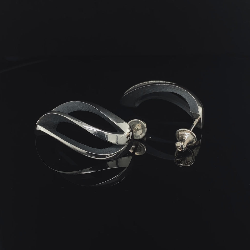 Video of Sarah Herriot's Contemporary Silver Oxidised 3 Way Twist Statement Earrings. Available on DESIGNYARD.com and in our Jewellery Shop Dublin, Ireland. Free Worldwide Shipping with DHL.