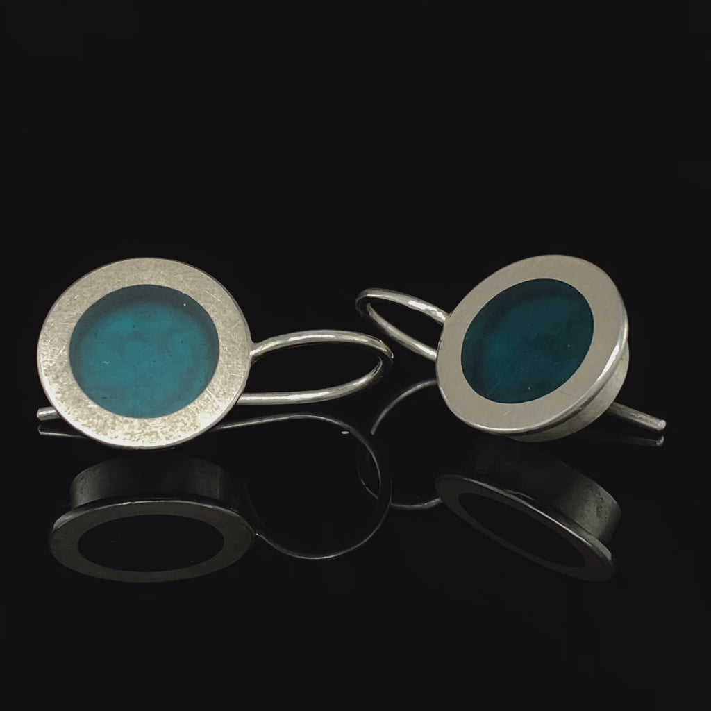 Video of Monika Jakubec's Contemporary Silver Petrol Blue Resin Drop Statement Earrings. Available on DESIGNYARD.com and in our Jewellery Shop Dublin, Ireland. Free Worldwide Shipping with DHL.