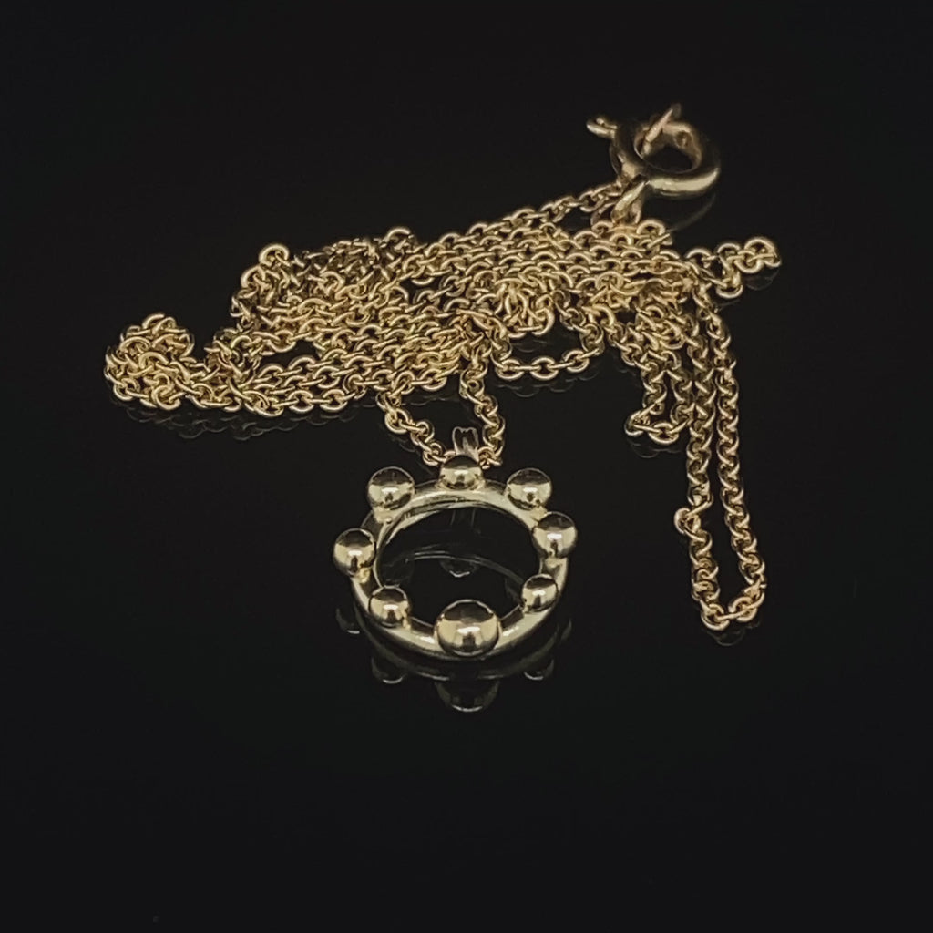 Video of Neeltje Huddleston Slater's 14k Yellow Gold Circle Dot Pendant. Available on DESIGNYARD.com and in our Contemporary Jewellery Shop Dublin, Ireland. #1 for Contemporary Jewellery.