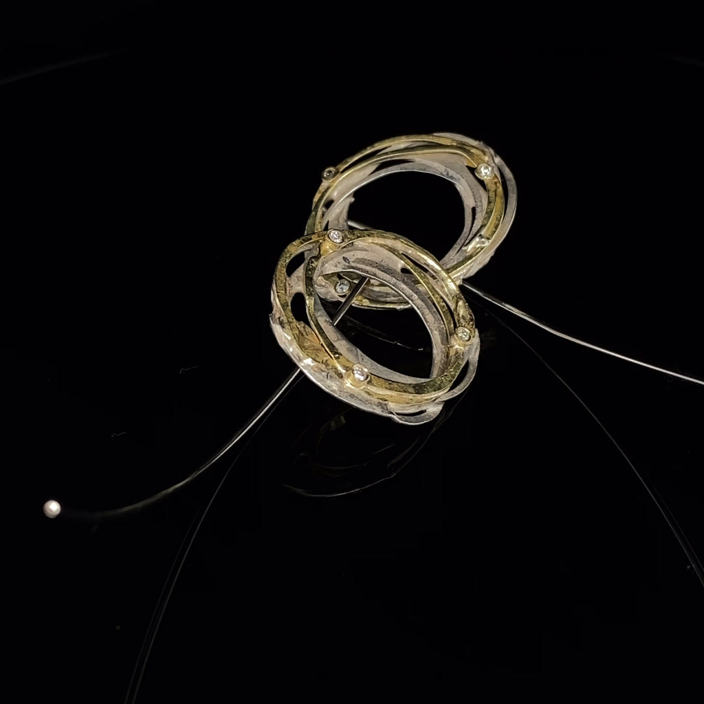 Video of Shimara Carlow's Contemporary Silver 18k Yellow Gold Diamond Wrap Hook Earrings. Available on DESIGNYARD.com and in our Jewellery Shop Dublin, Ireland. Free Worldwide Shipping with DHL.