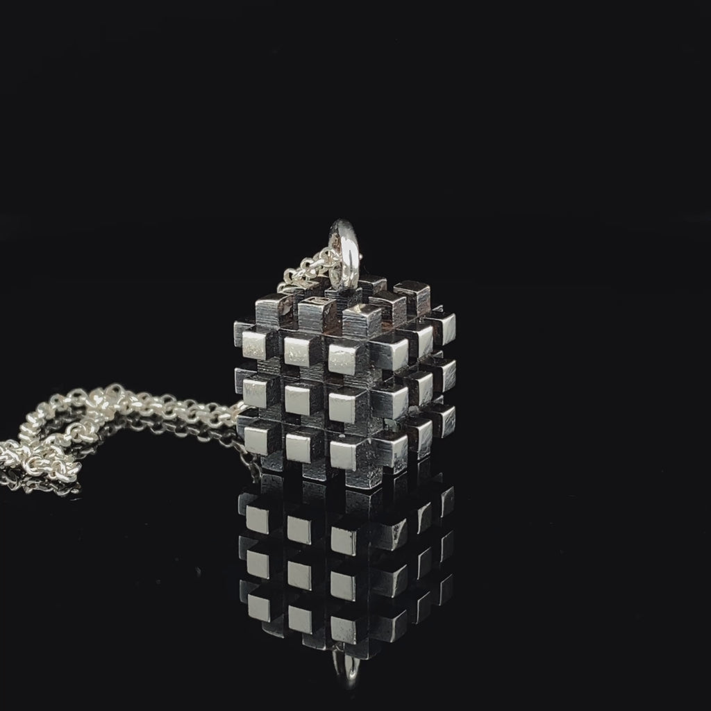 Video of Vanessa Ree's Contemporary Sterling Silver Oxi 3D# Negative Small Pendant. Available on DESIGNYARD.com and in our Jewellery Shop Dublin, Ireland. Free Worldwide Shipping with DHL.