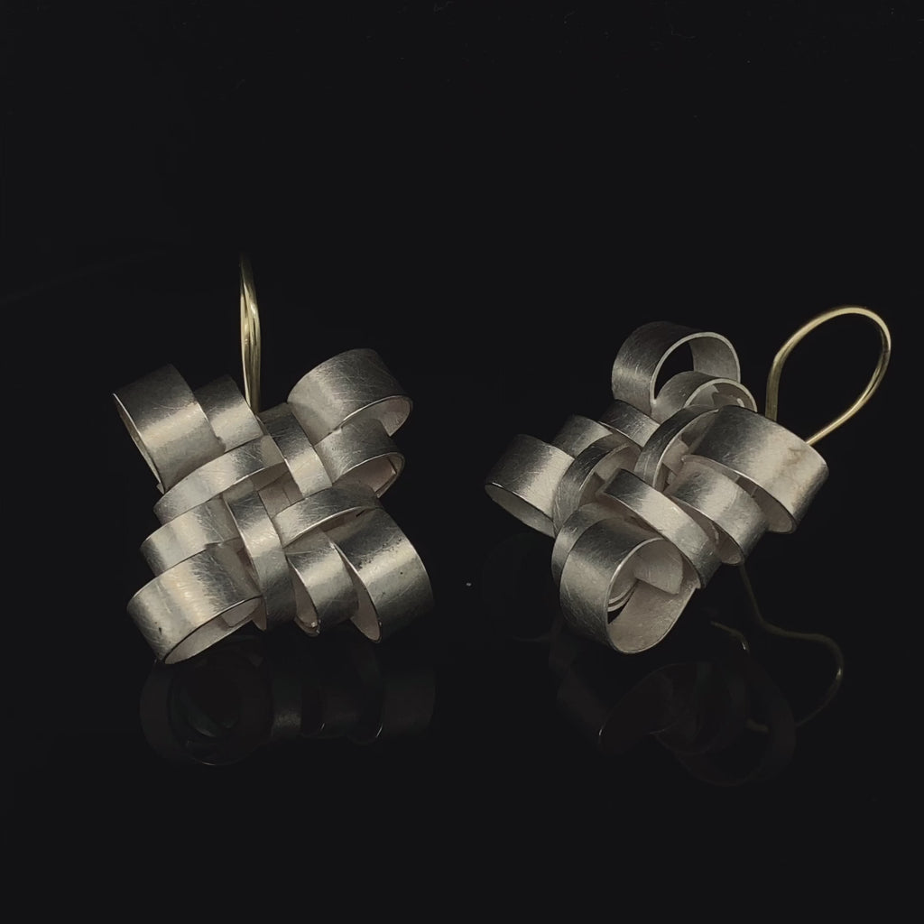 Video of Sophia Epp's Contemporary Silver 18k Yellow Gold Knot Hook Statement Earrings. Available on DESIGNYARD.com and in our Jewellery Shop Dublin, Ireland.