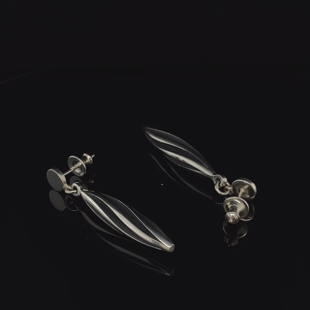 Video of Sarah Herriot's Contemporary Silver Oxidised Beat Twist Statement Earrings. Available on DESIGNYARD.com and in our Jewellery Shop Dublin, Ireland. Free Worldwide Shipping with DHL.