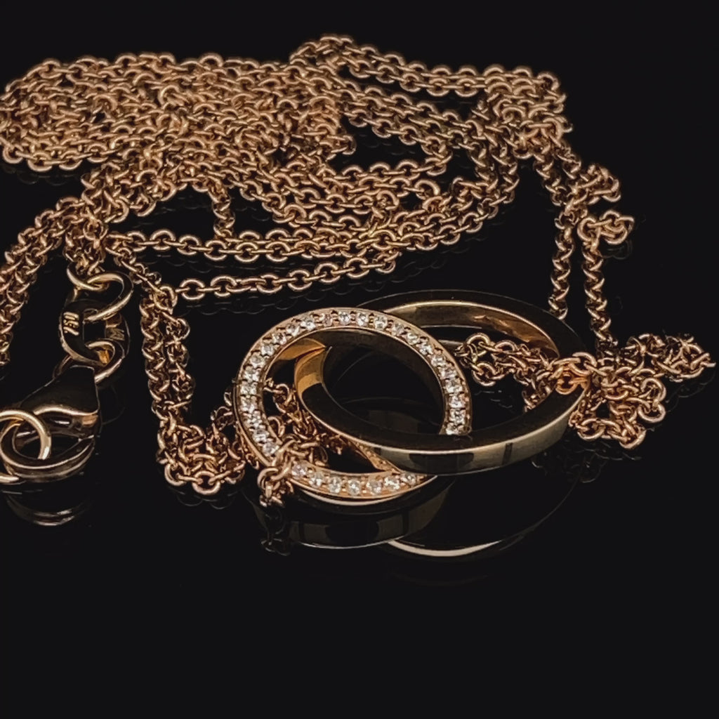 Video of Meister's Contemporary 18k Rose Gold Two Rings Interlocking Diamond Necklace. Available on DESIGNYARD.com and in our Jewellery Shop Dublin, Ireland. Free Worldwide Shipping with DHL.