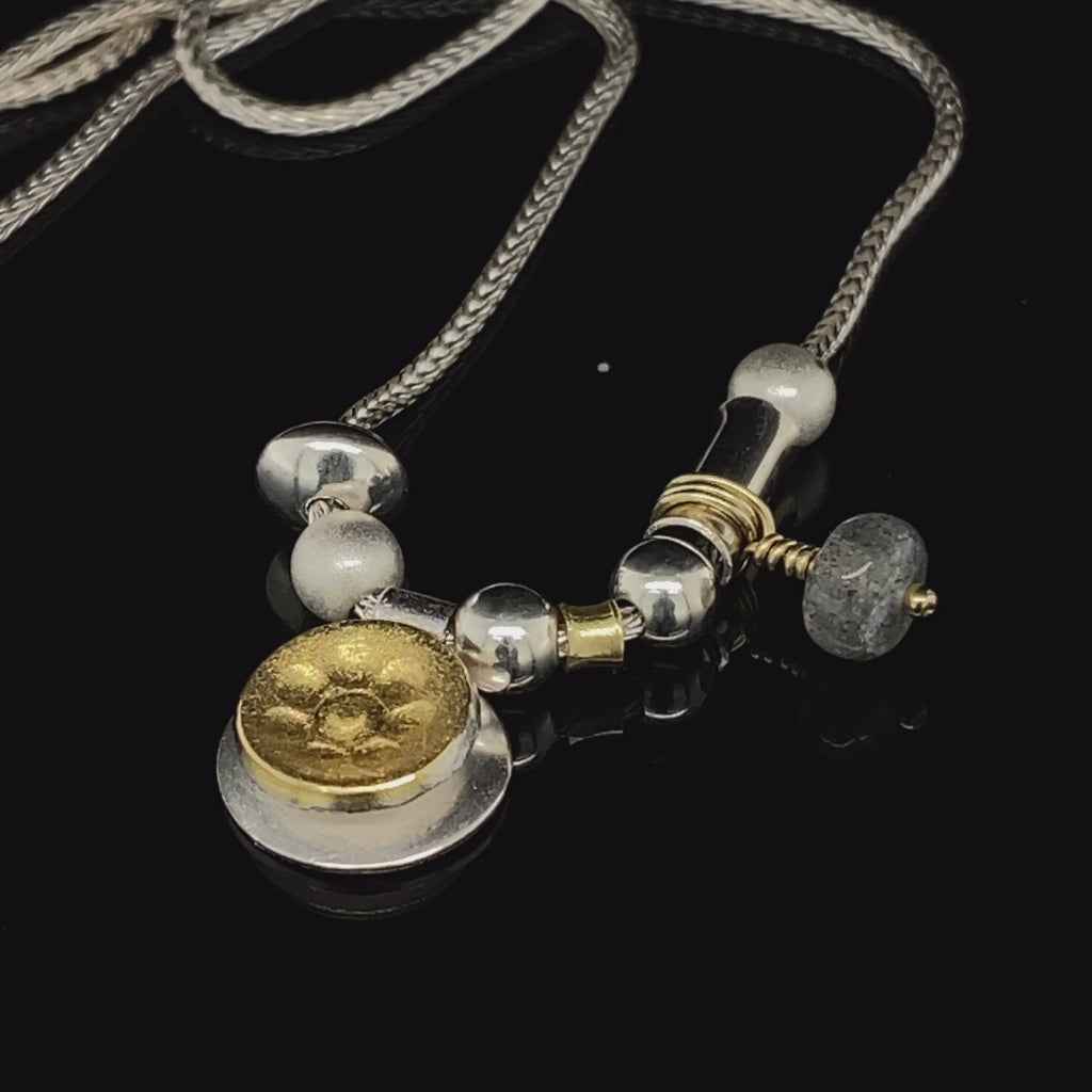 Video of Manu's Contemporary Sterling Silver 22k Yellow Gold Labradorite Necklace. Available on DESIGNYARD.com and in our Jewellery Shop Dublin, Ireland.