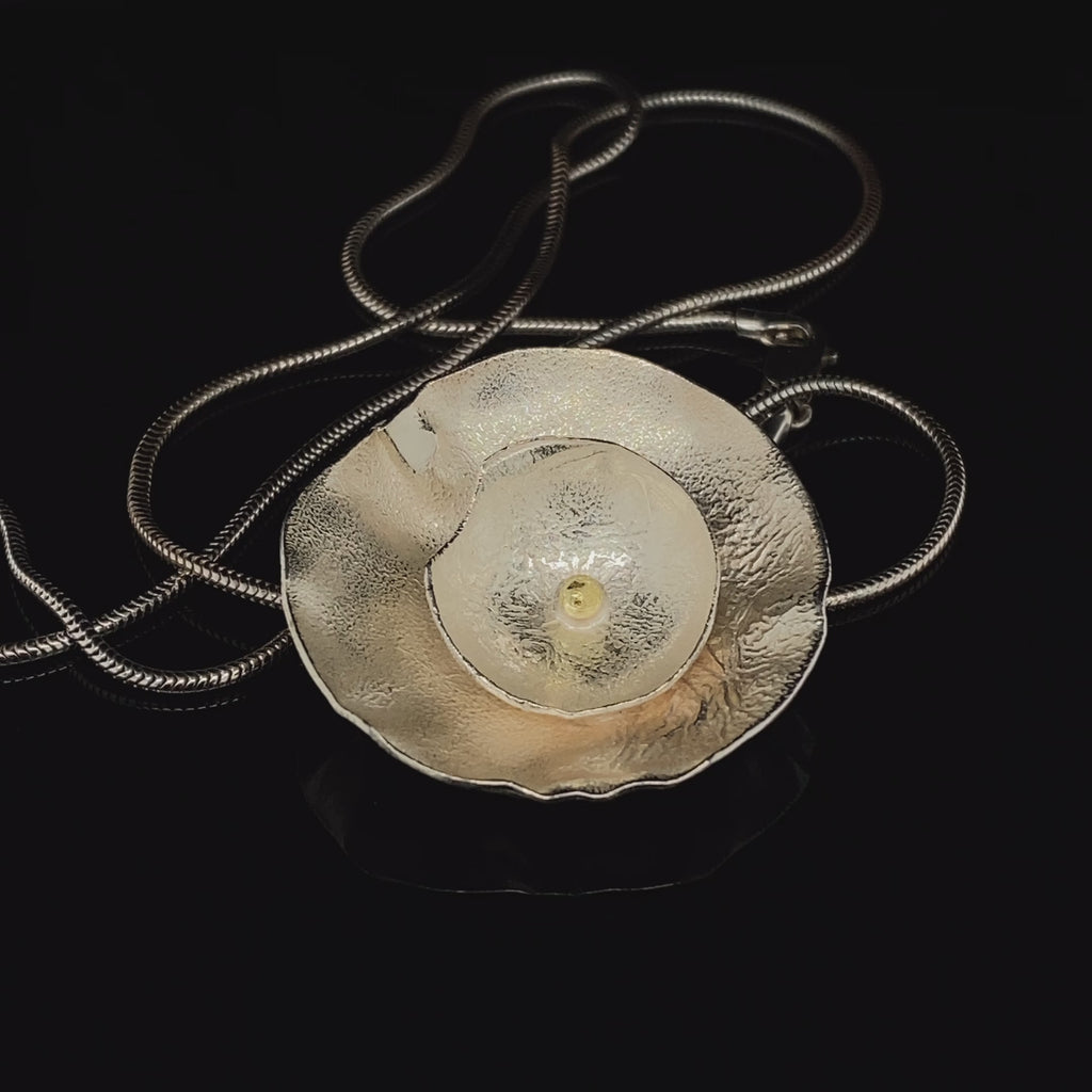 Video of Shimara Carlow's Contemporary Silver & 18k Yellow Gold Double Daisy Pendant. Available on DESIGNYARD.com and in our Jewellery Shop Dublin, Ireland. Free Worldwide Shipping with DHL.