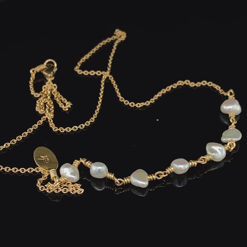 Video of Josephine Bergsøe's Contemporary Yellow Gold Keshi Pearl Leaf Statement Necklace. Available on  DESIGNYARD.com and in our Jewellery Shop Dublin, Ireland. Free Worldwide Shipping with DHL.