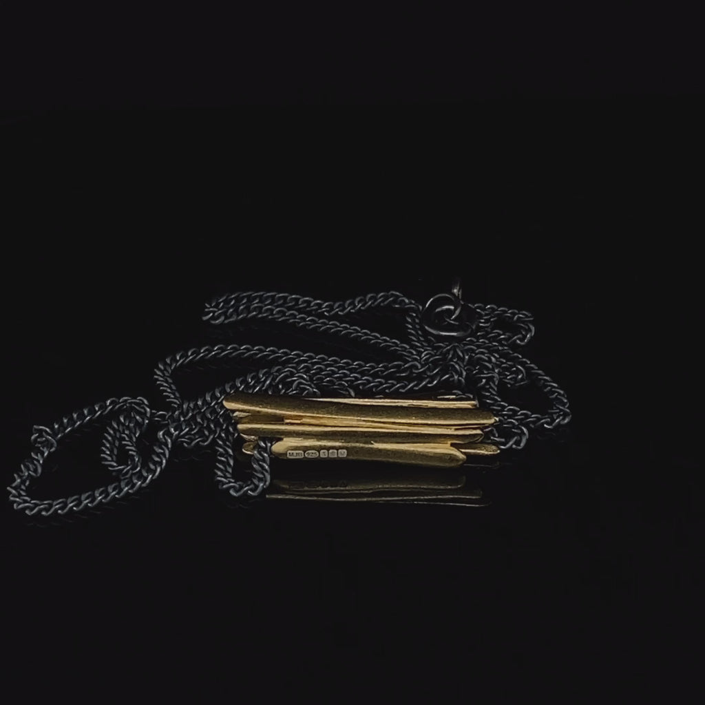 Video of Mirri Damer's Contemporary Oxidised Silver Gold Drift Pendant. Available on DESIGNYARD.com and in our Jewellery Shop Dublin, Ireland. Free Worldwide Shipping with DHL.