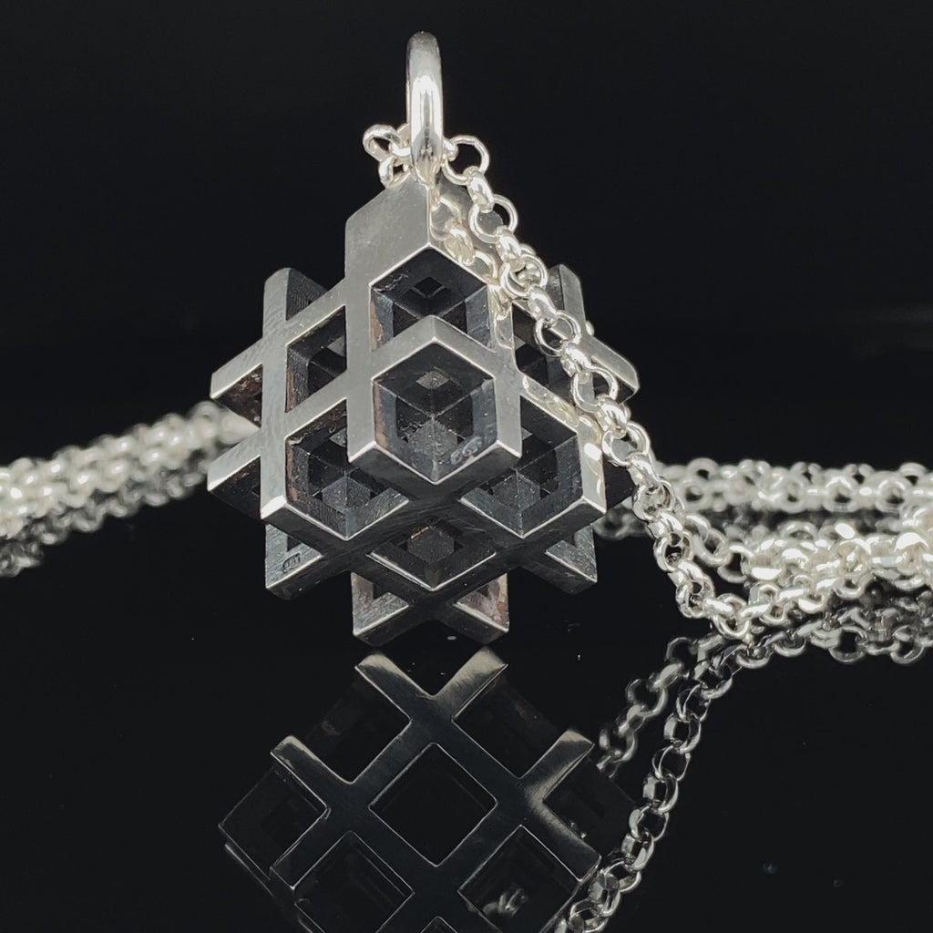 Video of Vanessa Ree's Contemporary Sterling Silver Oxi 3D# Positive Large Pendant. Available on DESIGNYARD.com and in our Jewellery Shop Dublin, Ireland. Free Worldwide Shipping with DHL.