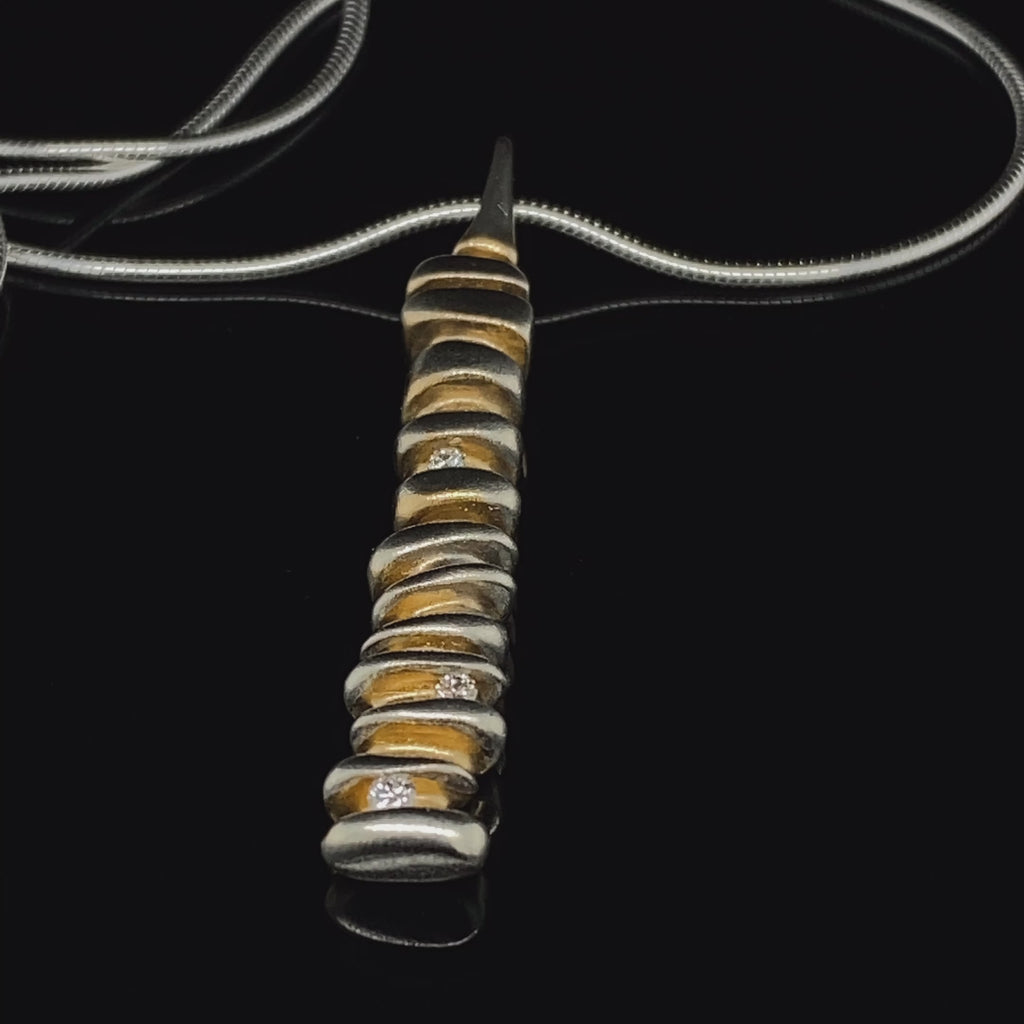 Video of Paul Finch's Silver 22k Yellow Gold 3 Diamond Pendant. Available on DESIGNYARD.com and in our Jewelry Store Dublin, Ireland.