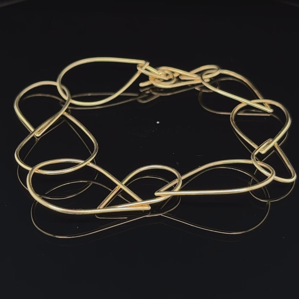 Video of Nicole Van Der Wolf's Contemporary 14k Yellow Gold Splash Statement Bracelet. Available on DESIGNYARD.com and in our Jewellery Shop Dublin, Ireland. Free Worldwide Shipping with DHL.
