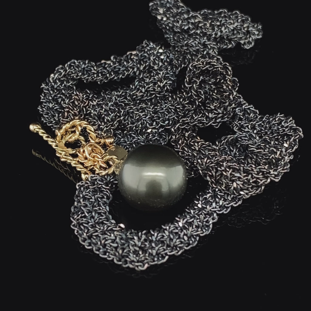 Video of Myriam Oude Vrielink's Oxidized Silver 14k Yellow Gold Tahiti Pearl Single Ribbon Necklace. Available on DESIGNYARD.com and in our Contemporary Jewellery Shop Dublin, Ireland. #1 for Contemporary Jewellery.