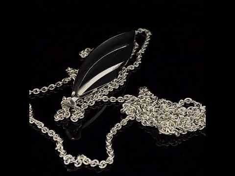 Video of Sarah Herriot's Silver Oxidised Beat Twist Statement Pendant. Available on DESIGNYARD.com and in our Contemporary Jewellery Shop Dublin, Ireland. Free Worldwide Shipping with DHL.