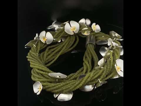 Video of Inga Reed's Contemporary Silver 22k Yellow Gold Serpentine Orchid Statement Neckpiece. Available on DESIGNYARD.com and in our Jewelry Store Dublin, Ireland.