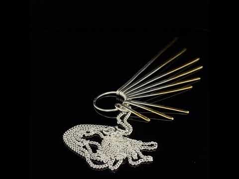Video of Kokkino's Shimmer Cascade Silver & Yellow Gold Necklace. Available on DESIGNYARD.com and in our Contemporary Jewellery Shop Dublin, Ireland. Free Shipping Worldwide with DHL.