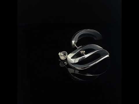 Video of Sarah Herriot's Silver Oxidised 3 Way Twist Statement Earrings. Available on DESIGNYARD.com and in our Contemporary Jewellery Shop Dublin, Ireland. Free Worldwide Shipping with DHL.