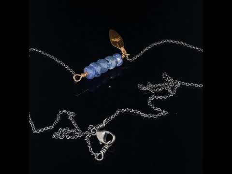 Video of Josephine Bergsøe's 18k 24k Yellow Gold Sapphire Leaf Necklace. Available on DESIGNYARD.com and in our Contemporary Jewellery Shop Dublin,  Ireland. Free Worldwide Shipping with DHL.