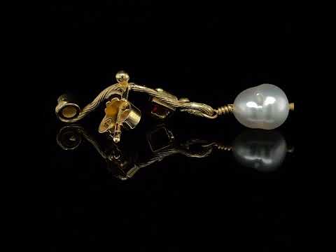 Video of Josephine Bergsøe's 18k & 22k Yellow Gold Ruby Keshi Pearl Diamond Seafire Single Earring. Available on DESIGNYARD.com and in our Contemporary Jewellery Gallery Dublin, Ireland. Free Worldwide Shipping with DHL.