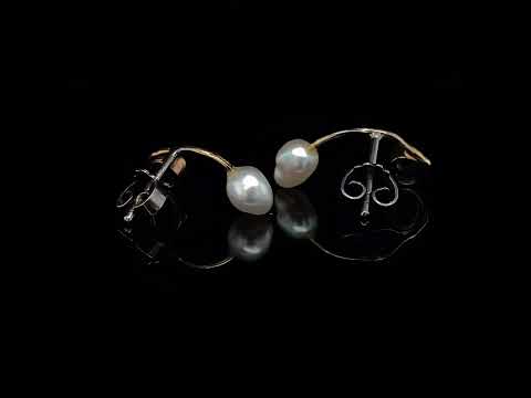 Video of Josephine Bergsøe's Silver & Yellow Gold Blue Sapphire Keshi Pearl Seafire Earrings. Available on DESIGNYARD.com and in our Contemporary Jewellery Shop Dublin, Ireland. Free Worldwide Shipping with DHL.