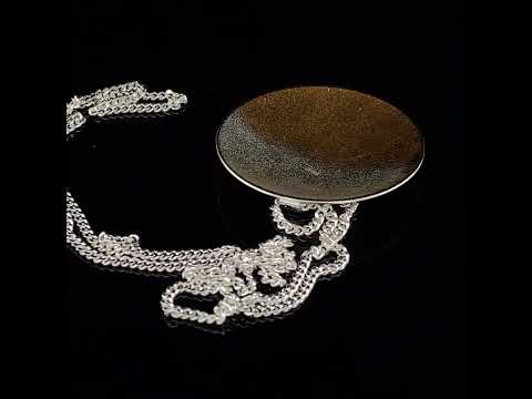 Video of Kokkino's Electra Large Silver & Yellow Gold Necklace. Available on DESIGNYARD.com and in our Contemporary Jewellery Shop Dublin, Ireland. Worldwide Shipping with DHL.