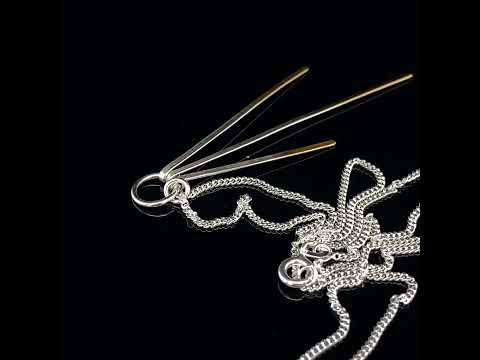 Video of Kokkino's Contemporary Shimmer Triple Silver 24k Yellow Gold Necklace. Available on DESIGNYARD.com and in our Jewellery Shop Dublin, Ireland. Shipping Worldwide with DHL.