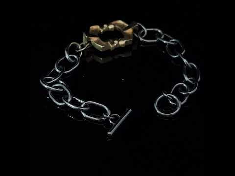 Video of Síne Vasquez's Contemporary 14k Yellow Gold Oxidised Silver Diamond Dwell Bracelet. Available on DESIGNYARD.com and in our Jewellery Shop Dublin, Ireland. Free Worldwide Shipping with DHL.