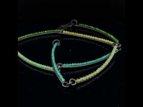 Video of Sophia Epp's Contemporary Oxidised Silver Peridot Chrome Diopside Quartz Statement Necklace. Available on DESIGNYARD.com and in our Jewellery Shop Dublin, Ireland. Free Worldwide Shipping with DHL.