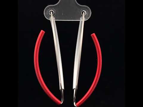 Video of Ursula Muller's Contemporary Red Aluminium Hoop Statement Earrings. Available on DESIGNYARD.com and in our Jewellery Shop Dublin, Ireland. Worldwide Shipping with DHL.