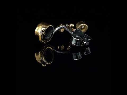 Video of Josephine Bergsøe's Silver & Yellow Gold Seafire Sapphire Single Earring. Available on DESIGNYARD.com and in our Contemporary Jewellery Shop Dublin, Ireland. Free Worldwide Shipping with DHL.